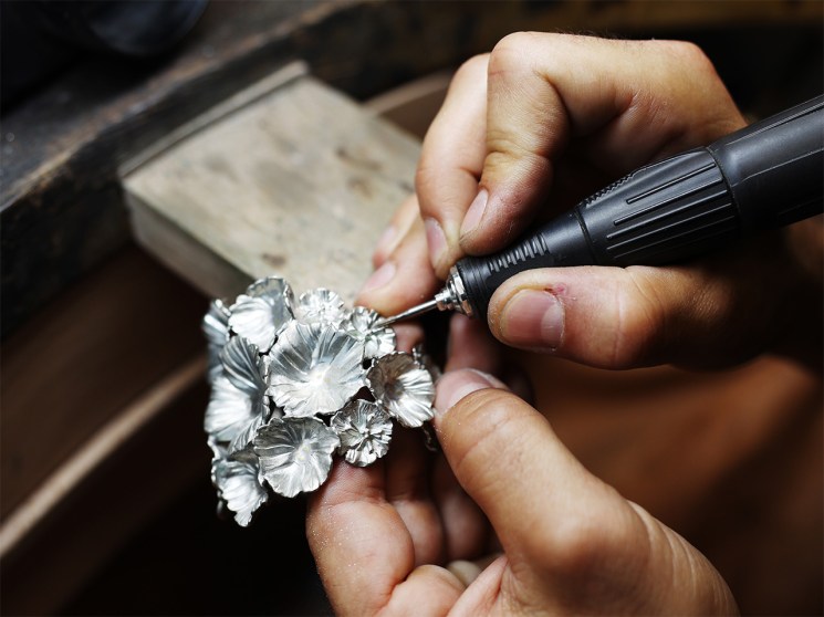 Artisan making a Fleur de Pavot cuff at Goossens the jewellery maker