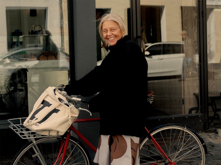 Rebekka Bay, creative director of Marimekko, rides her bike in Copenhagen