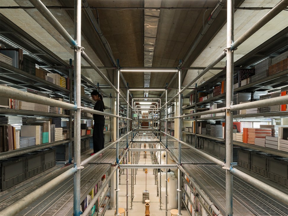 Twelvebooks inventory on open metal shelves