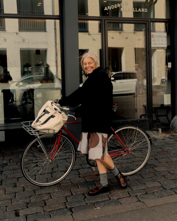 Rebekka Bay, creative director of Marimekko, rides her bike in Copenhagen