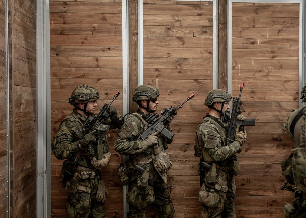 Polish soldiers practice storming a building