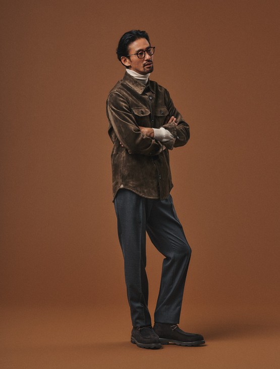 Male model poses in outfit by Brioni