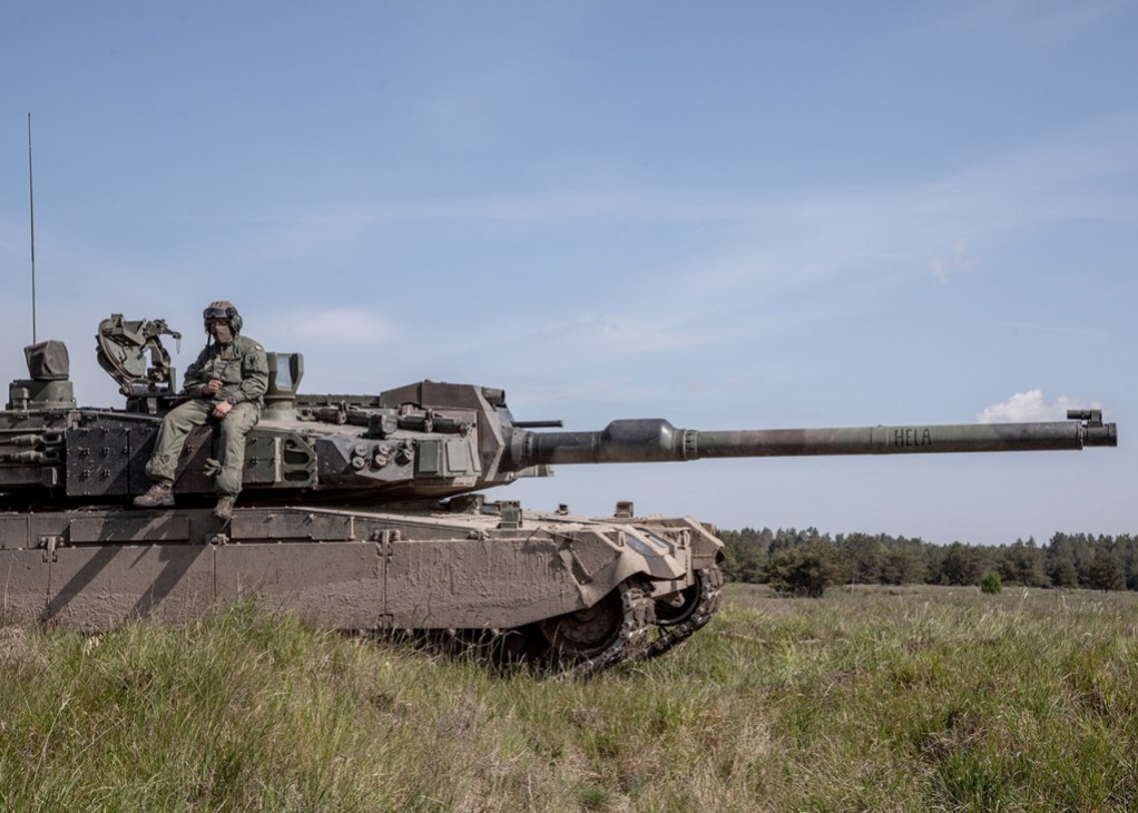 A Polish soldier sits on Poland’s first South Korean K2 tank