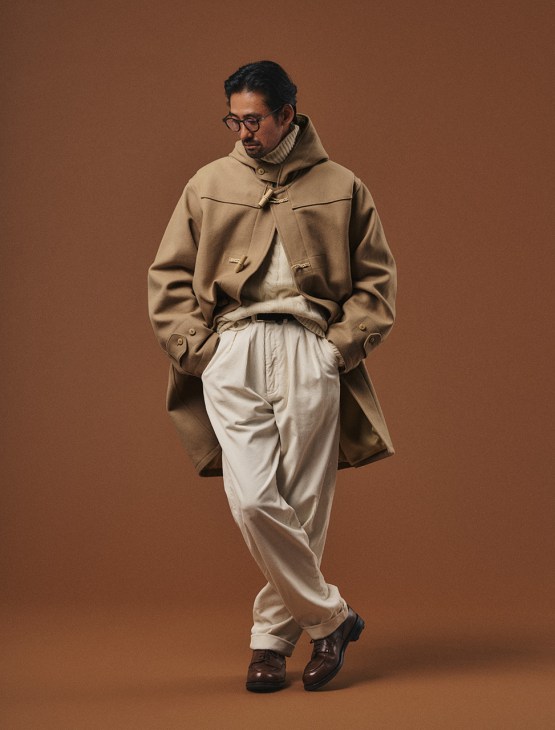 Male model in coat by Visvim, rollneck
jumper and trousers by Polo Ralph
Lauren, shoes by JM Weston, glasses by
Lindberg, belt by Athison