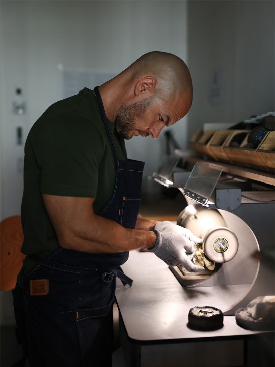 Hand-finishing a piece at Goossens’ atelier