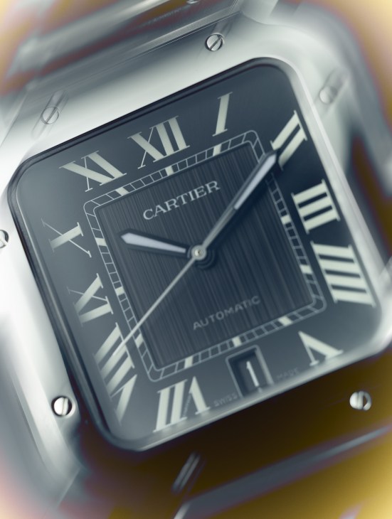A black Cartier Automatic watch face
