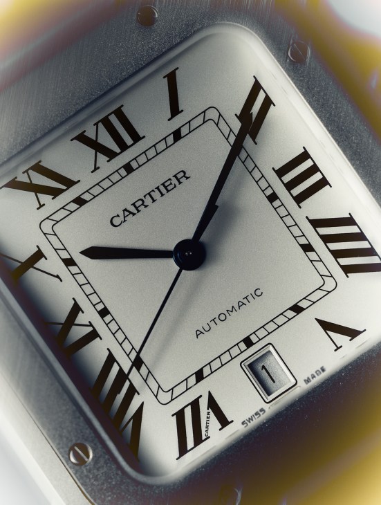 A white Cartier Automatic watch face