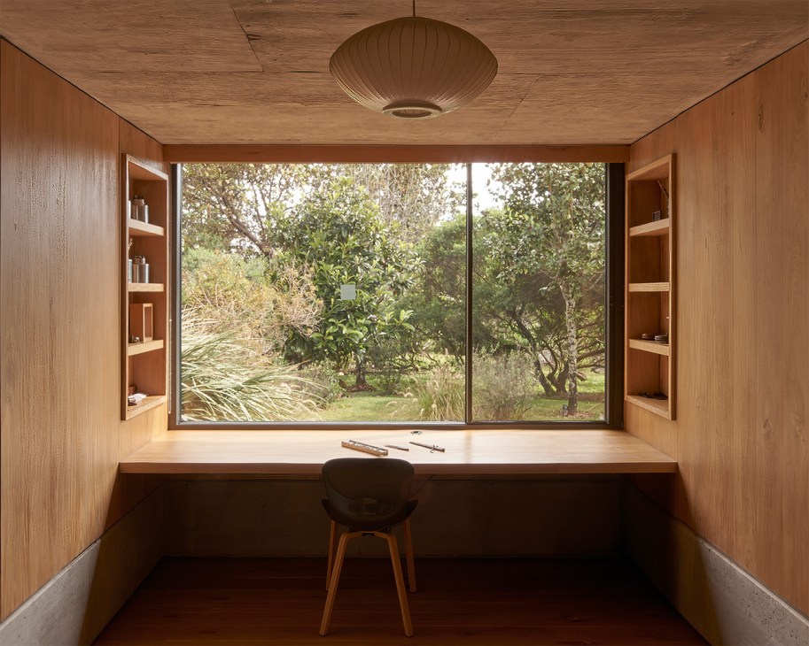 La Reserva Peñitas is framed through a large window inside a bunker-like study at Casa Terreno