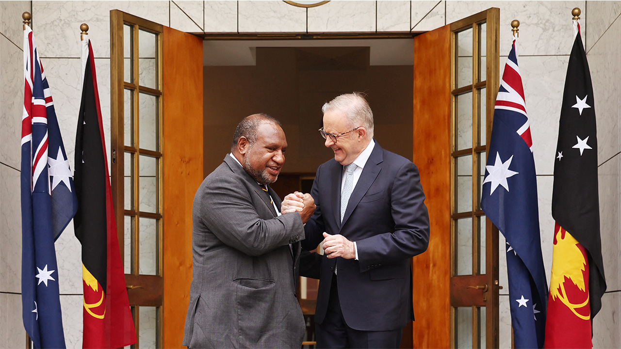 Australia's Prime Minister Anthony Albanese greets Papua New Guinea's Prime Minister James Marape before a signing ceremony at Parliament House in Canberra