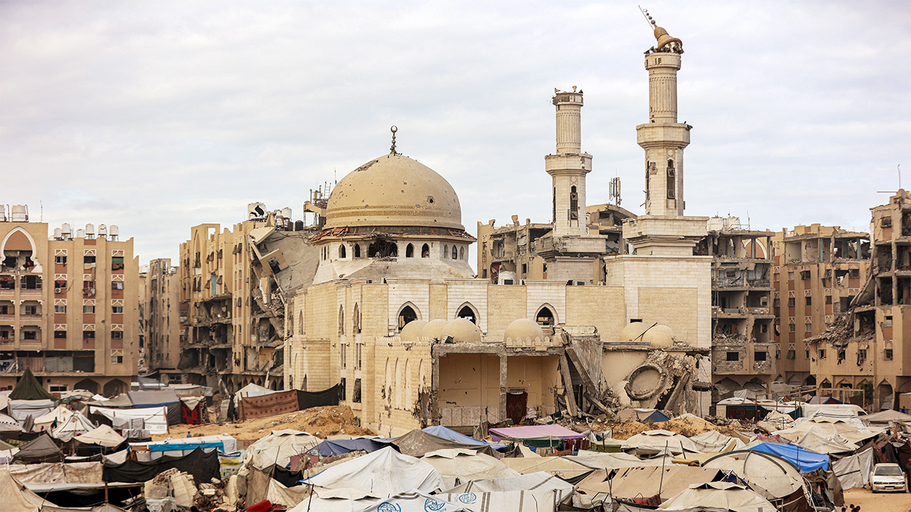 Tents sheltering people displaced by war are pitched near the heavily-damaged Sheikh Hamad bin Khalifa Al-Thani mosque at the Qatari-built Hamad City residential complex in northwestern Khan Yunis