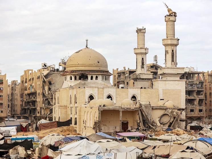 Tents sheltering people displaced by war are pitched near the heavily-damaged Sheikh Hamad bin Khalifa Al-Thani mosque at the Qatari-built Hamad City residential complex in northwestern Khan Yunis