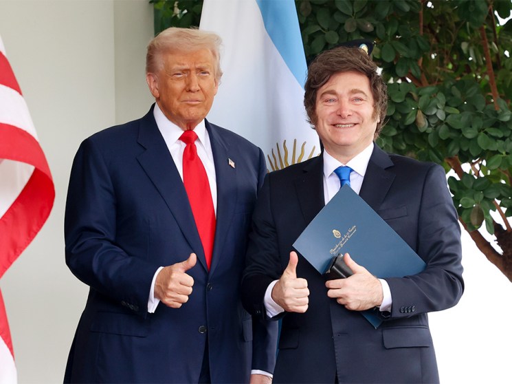 President Donald Trump poses beside Javier Milei