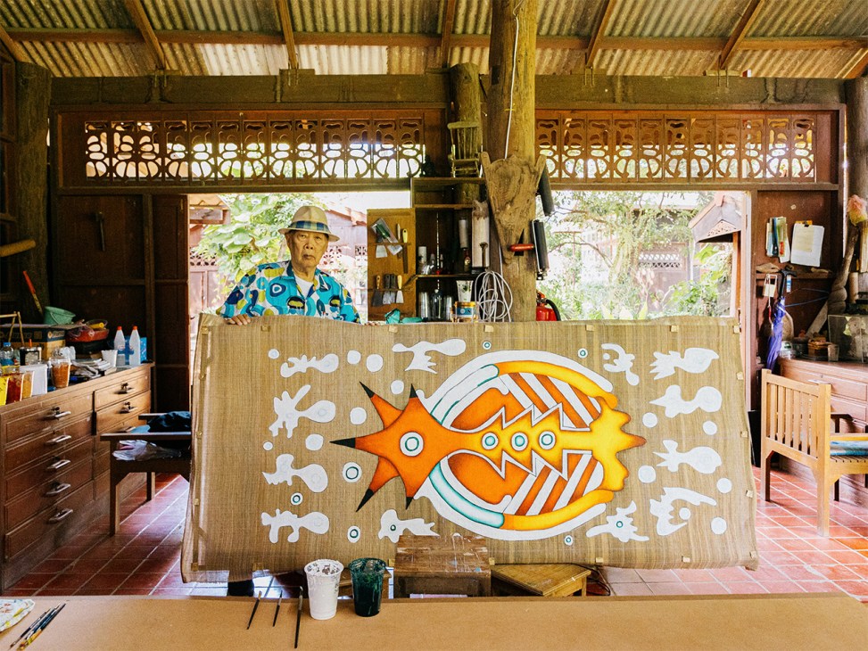 Inson Wongsam with his artwork