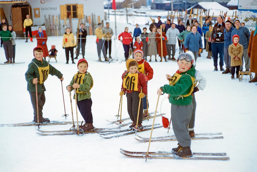 Young children skiing in historical image