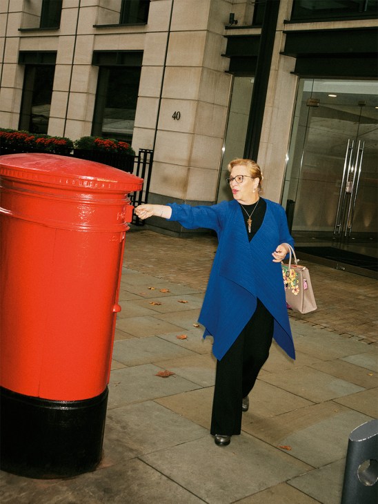 Josefa González-Blanco walks past a red post box