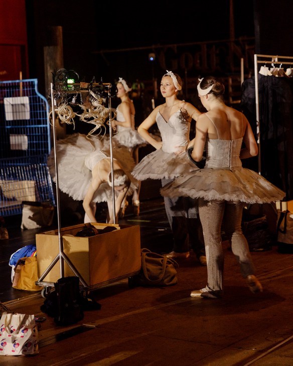 Ballet dancers standing backstage in tutus