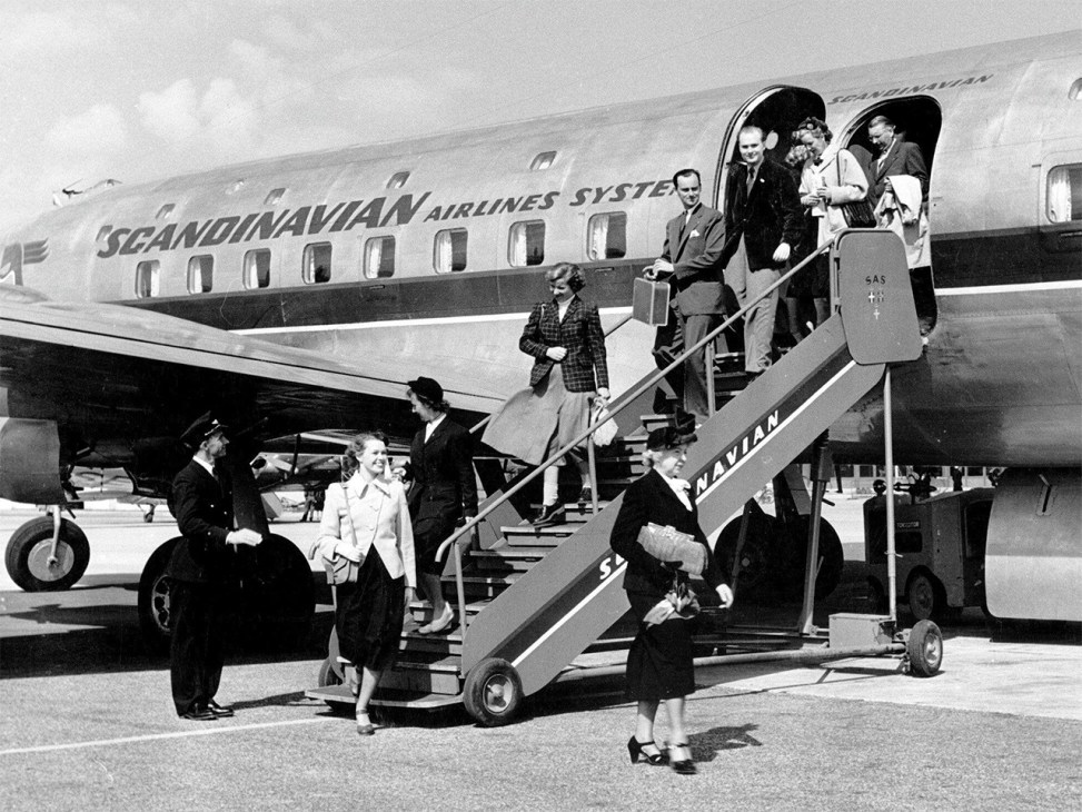 Smart choice: Disembarking a Scandinavian flight in Sweden in 1955 