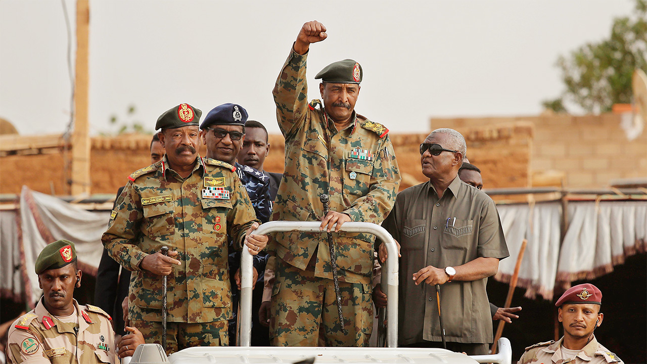 Sudanese Gen. Abdel-Fattah Burhan, head of the military council, waves to his supporters upon his arrival to attend a military-backed rally in Omdurman district, west of Khartoum, Sudan