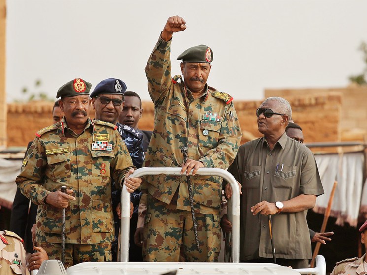 Sudanese Gen. Abdel-Fattah Burhan, head of the military council, waves to his supporters upon his arrival to attend a military-backed rally in Omdurman district, west of Khartoum, Sudan