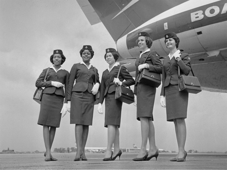 Black and white photo of cabin crew in vintage uniforms