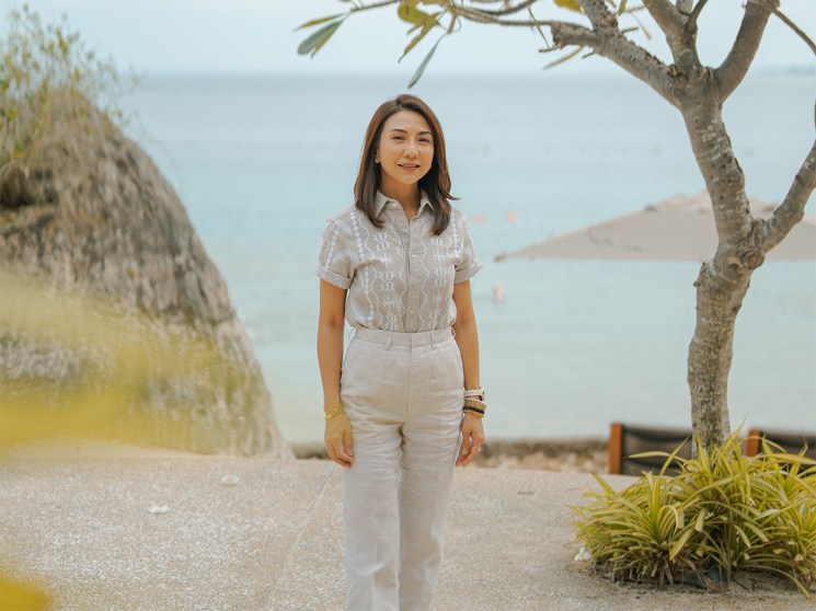 Christina Garcia Frasco stands in front of ocean view