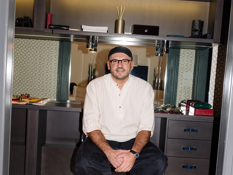 Dmytro Ievenko of Ienki Ienki sits on a stool looking at camera