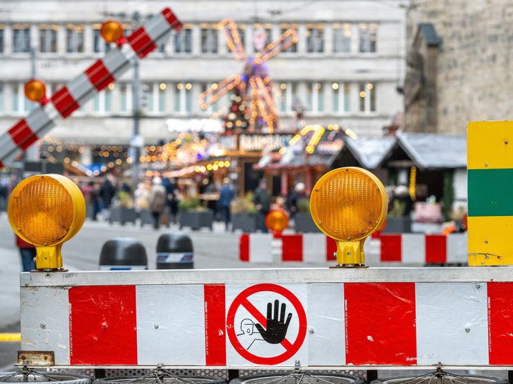 HALLE, GERMANY - NOVEMBER 26: New security systems involving barriers and road level nail traps have been placed at the road entrances to the Christmas Market to restrict vehicle access with public trams being the only exception on November 26, 2025 in Halle (Saale), Saxony-Anhalt, Germany. Many German Christmas markets are having to increase their security measures following the Magdeburg Christmas market attack last year. On December 20, 2024 Taleb al-Abdulmohsen drove a car into the crowded open-air market, killing six people and injuring over 300. The city of Halle has experienced a terror attack back in October 2019 during the Jewish holiday of Yom Kippur when a Synagogue and Turkish restaurant were attacked by a far right gun man resulting in 2 fatalities. (Photo by Craig Stennett/Getty Images)