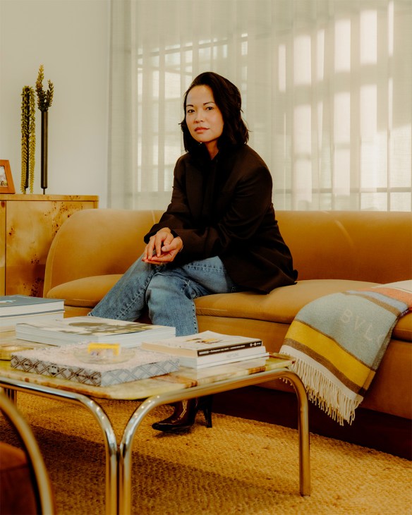 Portrait of Erina Pindar sitting on a couch