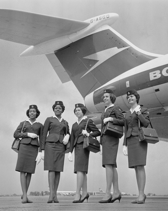 Black and white photo of cabin crew in vintage uniforms