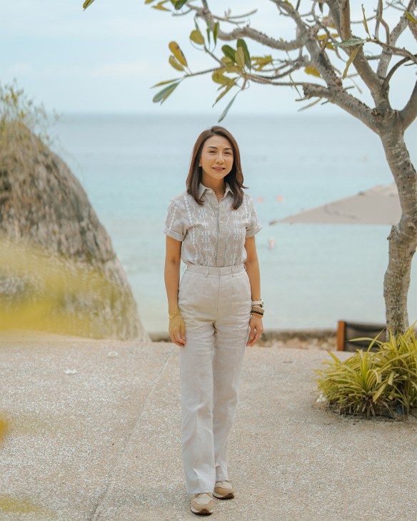 Christina Garcia Frasco stands in front of ocean view