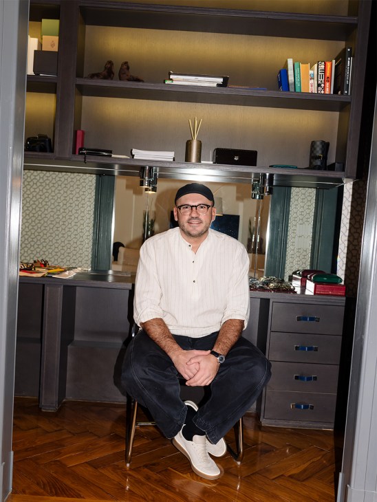 Dmytro Ievenko of Ienki Ienki sits on a stool looking at camera