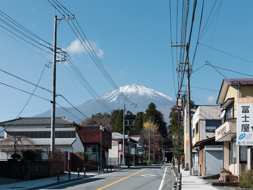 Mount Fuiji looms over a street scene