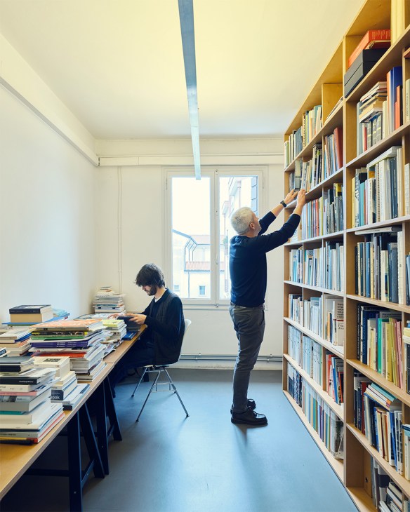 two people work in the CMP library