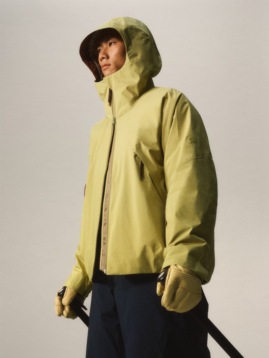 Model wearing Oyabe 2L jacket in yellow in studio