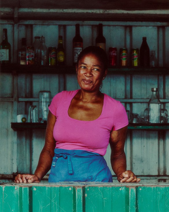 A bartender awaits customers at a football pitch in Santo António