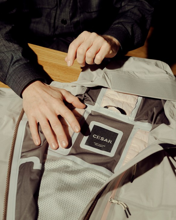 hands show off the interior detail of a jacket in Detail of the Active Tech range