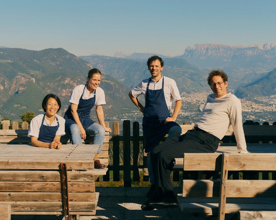The Pramol Alto team sitting outside with mountains in the background
