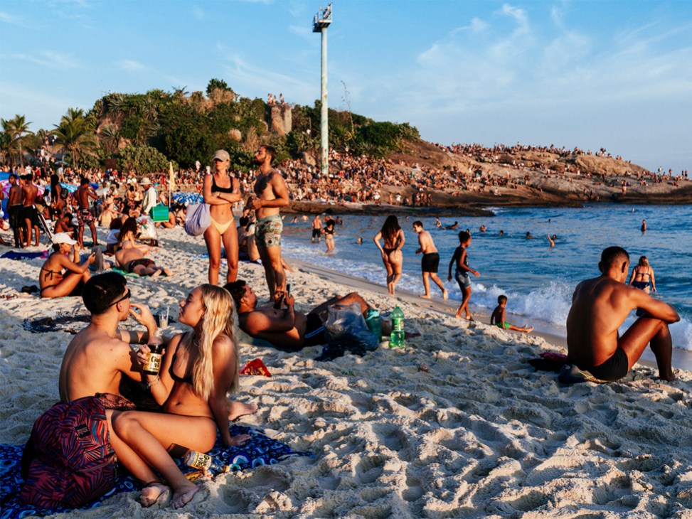 Tourists and locals relax on Ipanema beach in Rio de Janeiro, Brazil