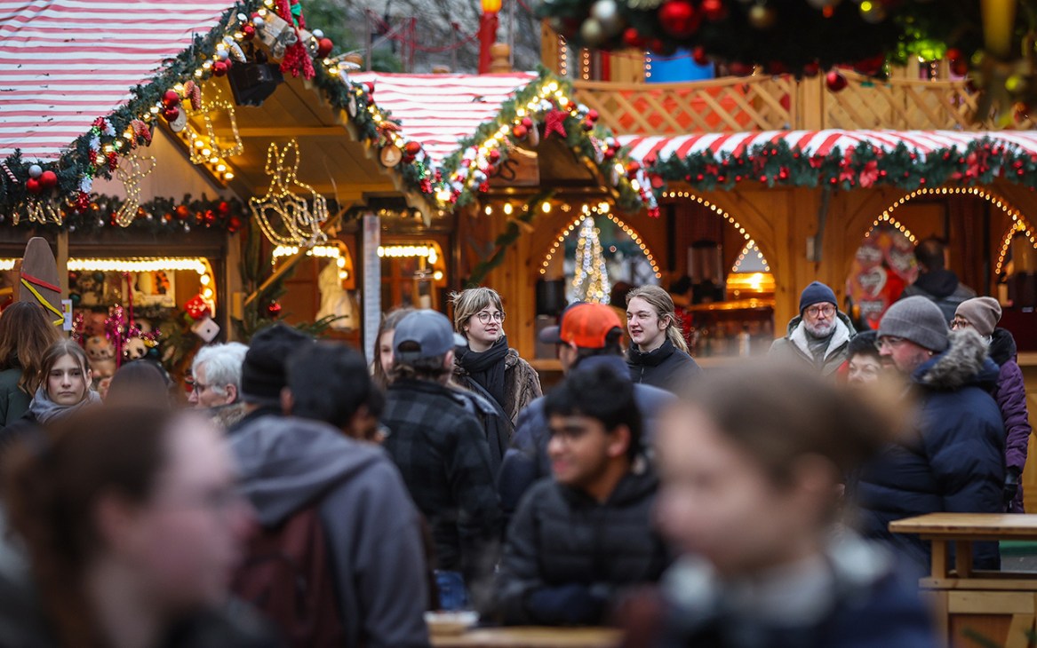 MAGDEBURG, GERMANY - NOVEMBER 20: Visitors attend the opening of the annual Christmas market on November 20, 2025 in Magdeburg, Germany. On December 20, 2024 Taleb al-Abdulmohsen, who is currently on trial, drove a car into the crowded open-air market, killing six people and injuring over 300. Christmas markets will open soon nationwide. Many are facing high costs due to increased security measures following the Magdeburg attack. (Photo by Ronny Hartmann/Getty Images)