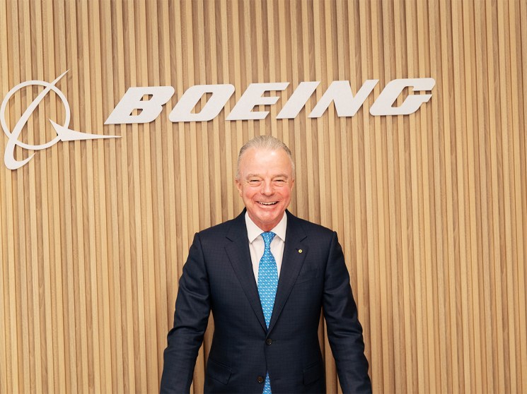 Boeing Global’s president, Brendan Nelson stands in front of a Boeing sign