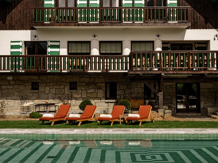 Le Sarto’s sloping roof and timber exterior, with mint-green shutters
