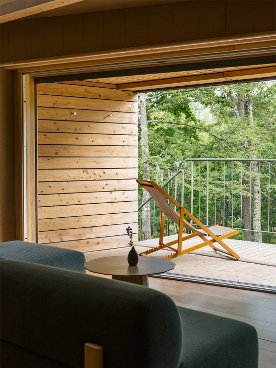 View from inside one of Sanu's cabins looking out at the forest
