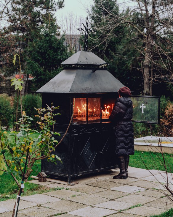 Small hut containing prayer candles in Iasi, Romania