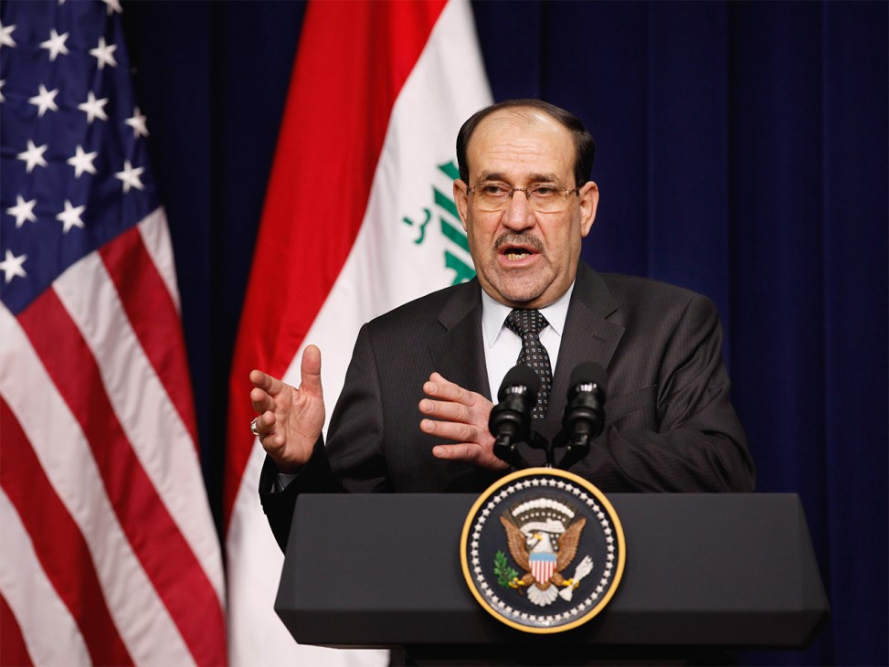 Nouri Al-Maliki answers questions during a news conference at the White House in 2011