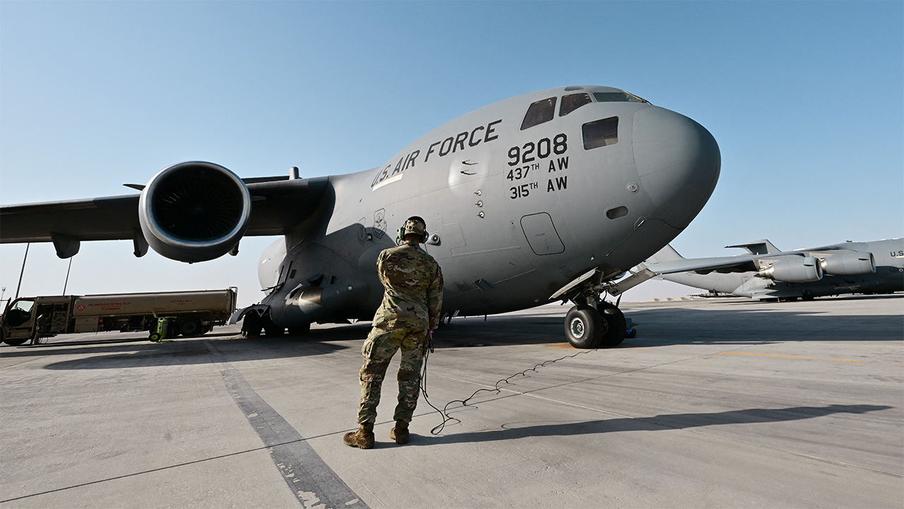 Iran threatens retaliation for any US strikes as American troops are evacuated from Middle East bases