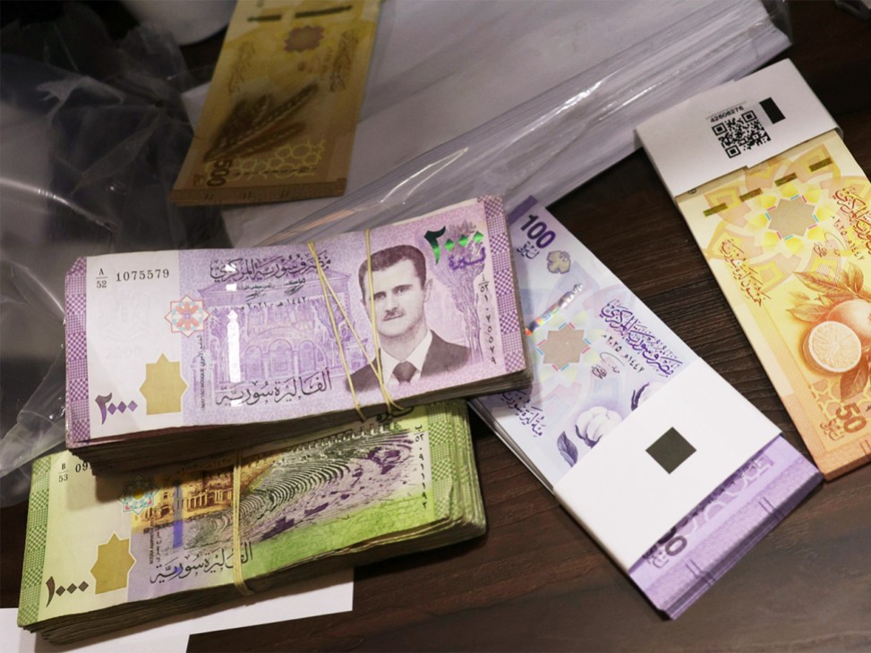 Syria’s old (left) and new banknotes