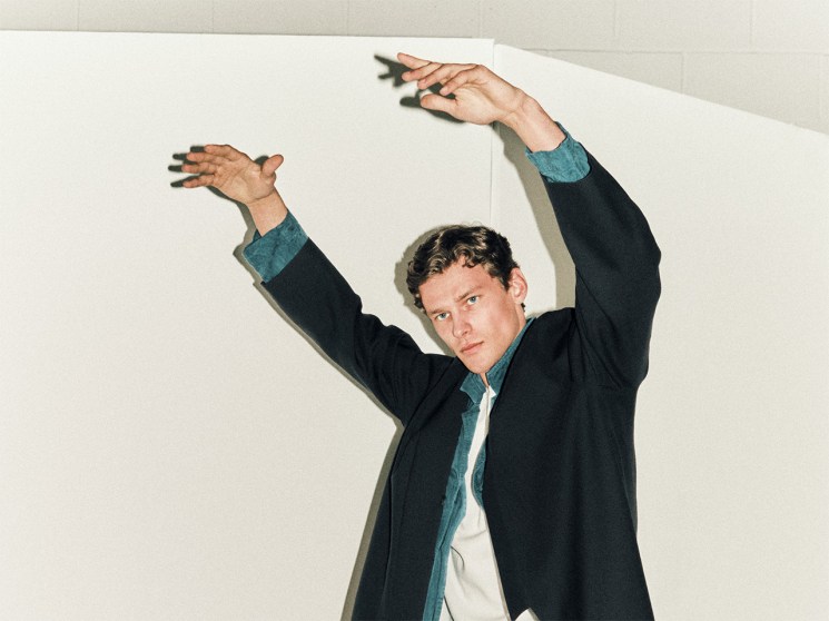 Model wearing a blue navy coat