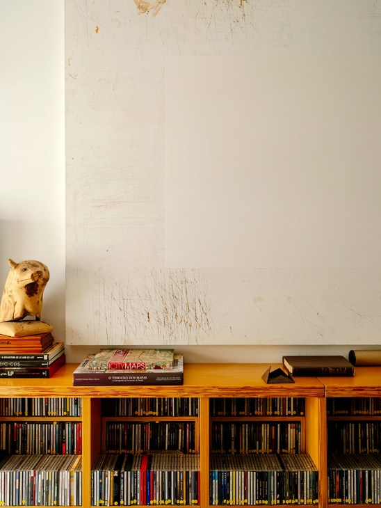 ...and his CD collection, below a painting by Daniel Senise