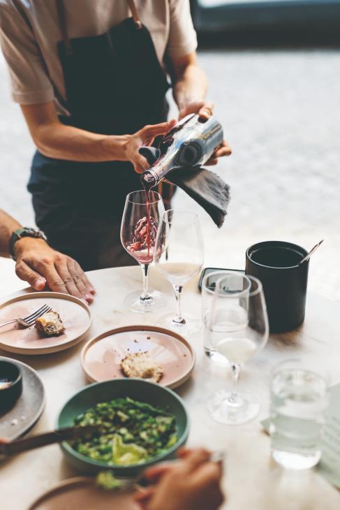 Server pouring wine in Porto