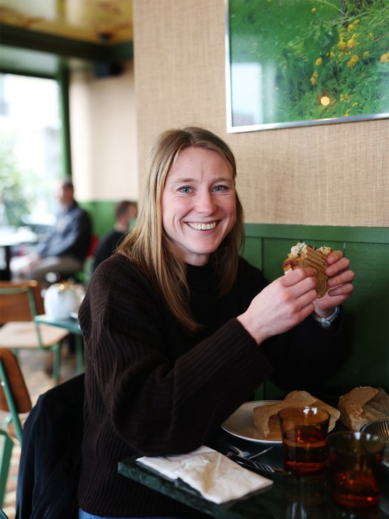 Woman having a sandwich at Deux Gares Express